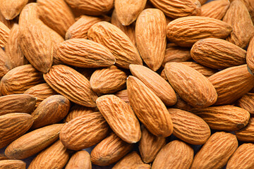 Background of big raw peeled almonds