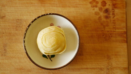 pastry on a plate on a wooden board - no person, nobody, high angle, indoors, daylight