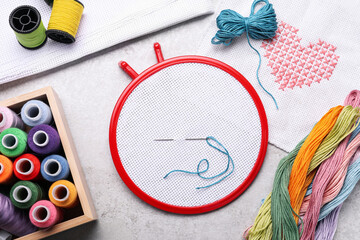 Flat lay composition with embroidery hoop on light grey background, top view © New Africa