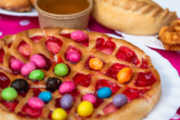 Pie multi-colored on the table. Food on the street in a cafe.