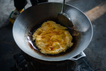 Thai style omelet in Thai street food restaurant