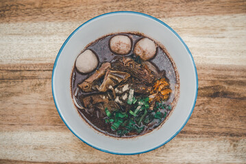 Fototapeta na wymiar Braised beef clear noodle with meat ball soup stew