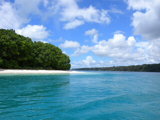 Blue sea and white sand with blue sky in Ujung Kulon Island, Banten - Indonesia