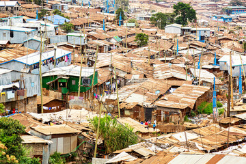 Kibera slum in Nairobi. Kibera is the biggest slum in Africa. Slums in Nairobi, Kenya. - obrazy, fototapety, plakaty