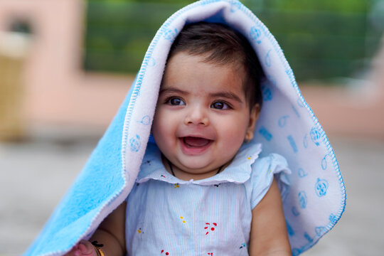 Indian baby girl child playing and giving smile