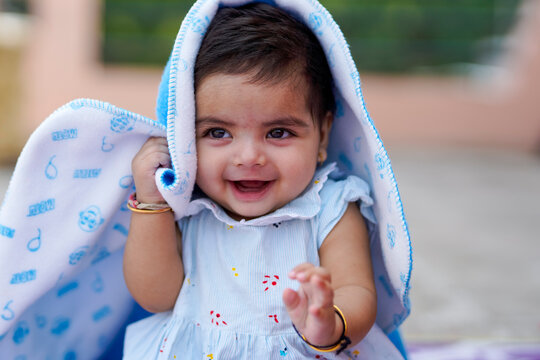Indian baby girl child playing and giving smile