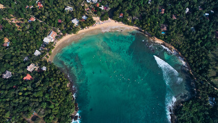 Aerial view of Hiriketiya Beach in Dikwella. Blue beach in Sri Lanka. Indian Ocean