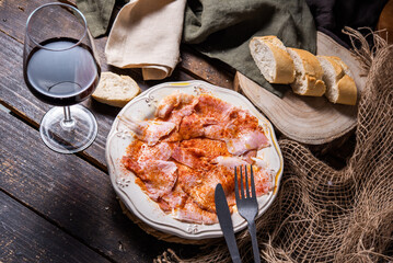 Typical Spanish tapa, Galician lacón, cut pork, with potatoes, paprika and olive oil. Appetizer, lunch or dinner.