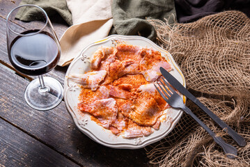 Typical Spanish tapa, Galician lacón, cut pork, with potatoes, paprika and olive oil. Appetizer, lunch or dinner.
