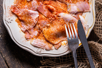 Typical Spanish tapa, Galician lacón, cut pork, with potatoes, paprika and olive oil. Appetizer, lunch or dinner.