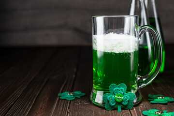 Green beer pint for Saint Patrick day on wooden table