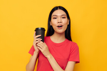 cheerful woman with black glass of drink posing