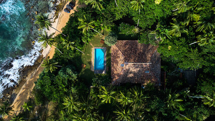 Aerial view of a villa with a swimming pool in the tropics. Hiriketiya beach, Sri Lanka © Dima Anikin