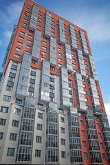 Fragment of the facade of an apartment building on a winter day