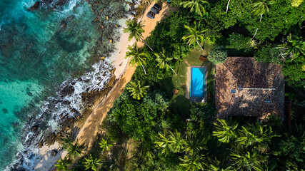 Aerial view of a villa with a swimming pool in the tropics. Hiriketiya beach, Sri Lanka