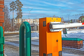Automatic barrier at the exit from the parking lot on a winter day