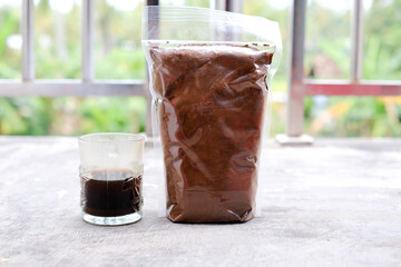 Black coffee in traditional Indonesian Lampung packaging.
Real coffee without mix