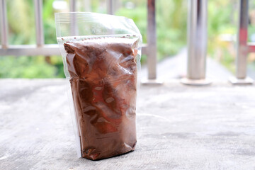 Black coffee in traditional Indonesian Lampung packaging.
Real coffee without mix