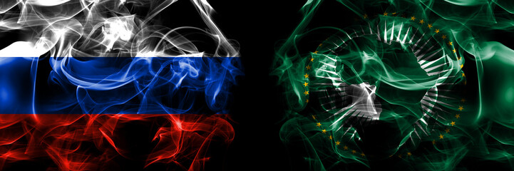 Russia, Russian vs African Union, Africa flags. Smoke flag placed side by side isolated on black background