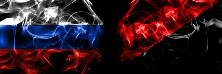Russia, Russian vs Anarchist, Anarcho, Syndicalist, Communist, Socialist flags. Smoke flag placed side by side isolated on black background