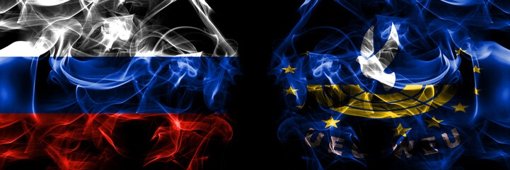 Russia, Russian vs Assembly Western European Union, EU flags. Smoke flag placed side by side isolated on black background