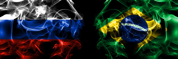 Russia, Russian vs Brazil, Brazilian flags. Smoke flag placed side by side isolated on black background