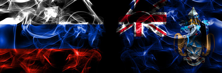 Russia, Russian vs British, Britain, Tristan da Cunha flags. Smoke flag placed side by side isolated on black background