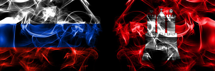 Russia, Russian vs Germany, Hamburg, city flags. Smoke flag placed side by side isolated on black background