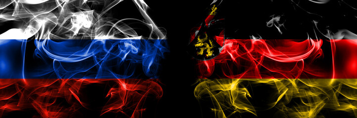 Obraz premium Russia, Russian vs Germany, Rhineland, Palatinate flags. Smoke flag placed side by side isolated on black background