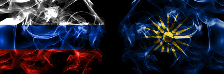 Russia, Russian vs Greece, Greek Macedonia flags. Smoke flag placed side by side isolated on black background