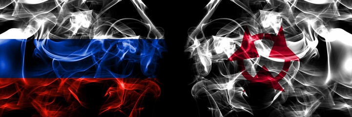 Russia, Russian vs Japan, Japanese, Oita Prefecture flags. Smoke flag placed side by side isolated on black background