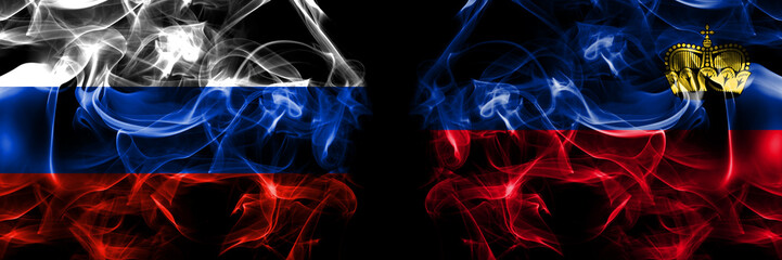 Obraz premium Russia, Russian vs Liechtenstein flags. Smoke flag placed side by side isolated on black background