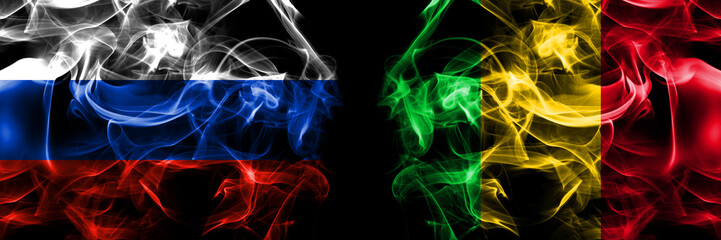 Russia, Russian vs Mali flags. Smoke flag placed side by side isolated on black background