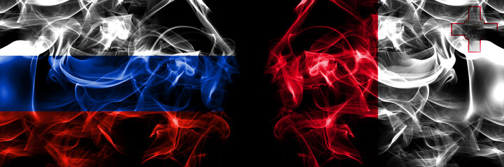 Obraz premium Russia, Russian vs Malta, Maltese flags. Smoke flag placed side by side isolated on black background