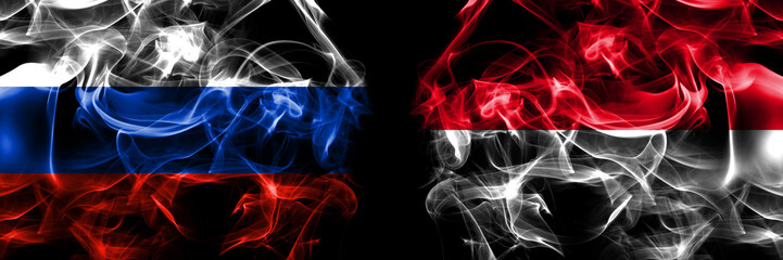 Russia, Russian vs Monaco, Monacan flags. Smoke flag placed side by side isolated on black background