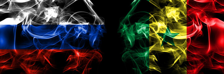 Russia, Russian vs Senegal flags. Smoke flag placed side by side isolated on black background