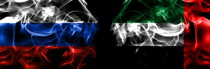 Russia, Russian vs United Arab Emirates, Emirati flags. Smoke flag placed side by side isolated on black background