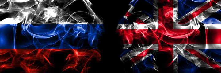 Russia, Russian vs United Kingdom, Great Britain, British flags. Smoke flag placed side by side isolated on black background