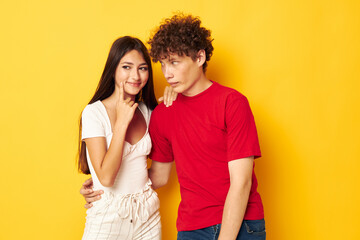 Fototapeta premium cute young couple together posing emotions close-up yellow background unaltered