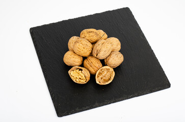 Ripe walnuts on black background. Studio Photo