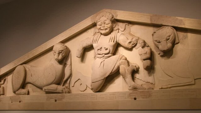 The stone pediment of Artemis Gorgon, originating from the temple of the Goddess Artemis in the Archeological Museum of Corfu Kerkyra, Greece, Ionian Islands