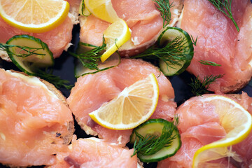 Sandwiches with red fish, lemon and herbs