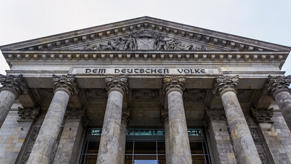 Architectural detail of the frontal part of the Reichstag, a historic building in the city of...