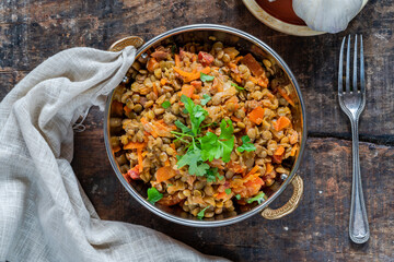 Green lentils stew with white wine, Serrano ham and smoked paprika