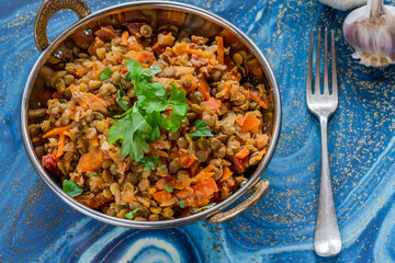 Green lentils stew with white wine, Serrano ham and smoked paprika