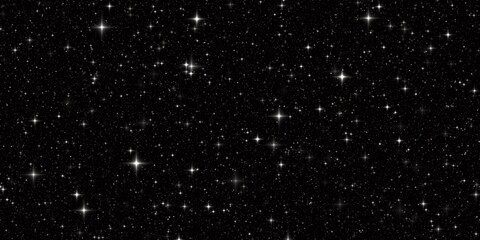 Cielo nocturno con estrellas brillando en la oscuridad.