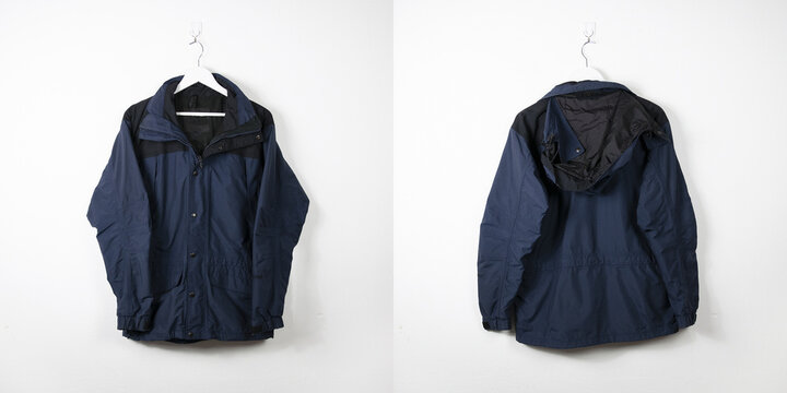 Clothes on a hanger. White wall background. 