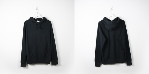 Clothes on a hanger. White wall background. 