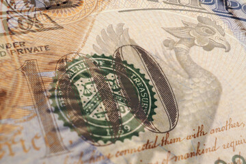 Fragments of Japanese and American paper money closeup. Yen and dollar. Banknote of 10,000 yen and bill of 100 dollars. Illustration about exchange rate. Currency of Japan and the US. Macro