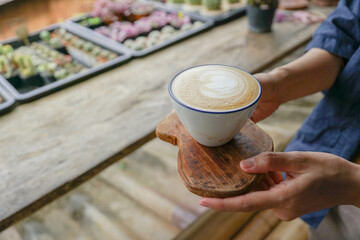 person holding a cup of coffee